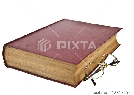 Old books with eye glasses isolated on white background Old books with eye glasses isolated on white background 12317552