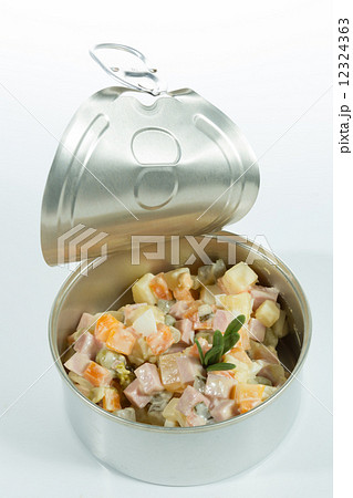 Appetizer. Creative cuisine. Russian salad in a tin can 12324363