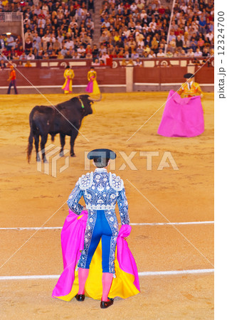 Matador and bull in bullfighting at Madrid 12324700