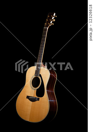 Acoustic Guitar with dark background  12326618