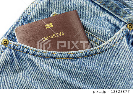 Closeup of credit card and passport in jeans in blue denim jeans Closeup of credit card and passport in jeans in blue denim jeans 12328377