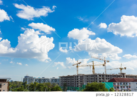 Construction site with cranes and blue sky background 12328817