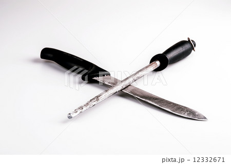 Knife and whetstone isolated on white background Knife and whetstone isolated on white background 12332671