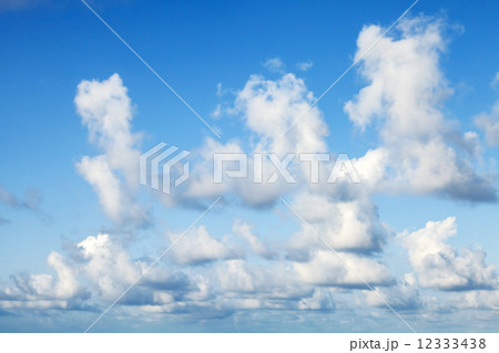 Bright blue sky background texture with soft white clouds Bright blue sky background texture with soft white clouds 12333438