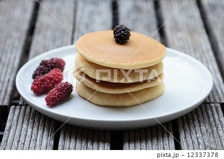 Stack of delicious pancakes with fresh fruits 12337378