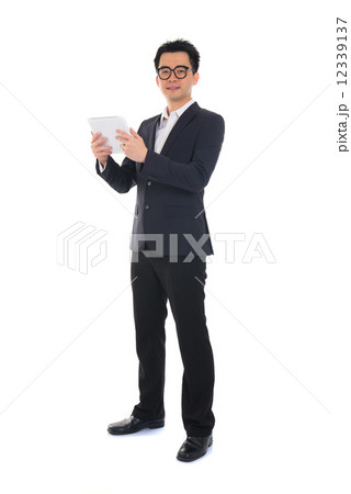 chinese business man using tablet 12339137