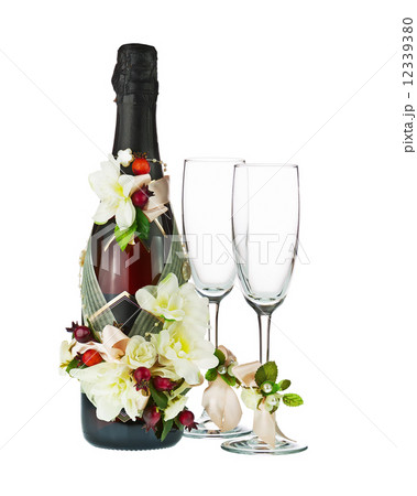Champagne Bottle and Glass with Wedding Decoration of Flower Arr Champagne Bottle and Glass with Wedding Decoration of Flower Arr 12339380
