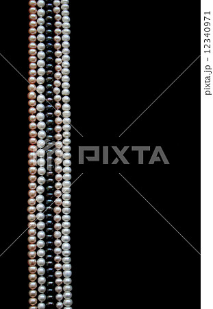 White, black and pink pearls on the black silk 12340971