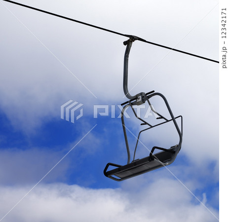 Chair-lift and cloudy sky 12342171