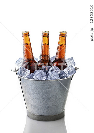 beer bottles in a bucket of ice 12358616