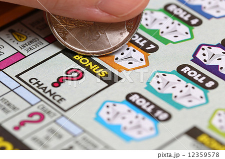 Woman scratching lottery ticket. It's published by BC Lottery Corporation Woman scratching lottery ticket. It's published by BC Lottery Corporation 12359578