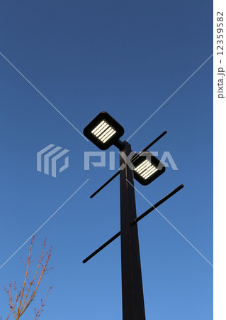 Road lamp against blue sky 12359582