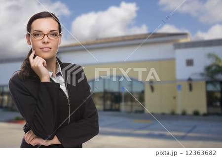 Woman In Front of Commercial Building Woman In Front of Commercial Building 12363682