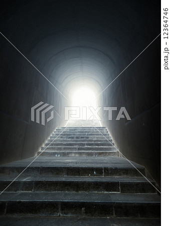 staircase in the tunnel with light at the end 12364746