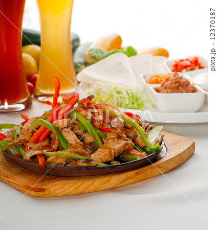 original fajita sizzling hot  on iron plate 12370187