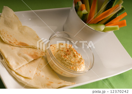 hummus dip with pita bread and vegetable 12370242