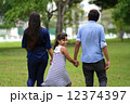 Young Indian family strolling in park 12374397