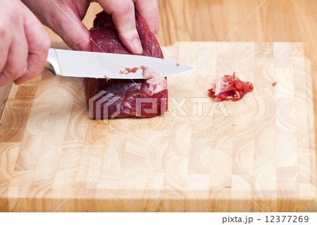Fat cut off on a piece beef tenderloin Fat cut off on a piece beef tenderloin 12377269
