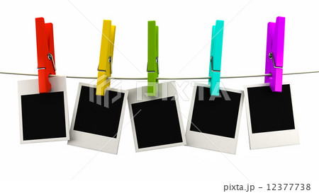 retro photo frame hanging on a rope on multicolored clothespins 12377738