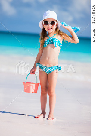 Adorable little girl at beach 12378816