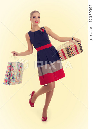 girl with a gift box and shopping bag 12379392