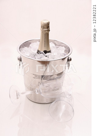 Champagne bottle in cooler and two champagne glasses 12382221