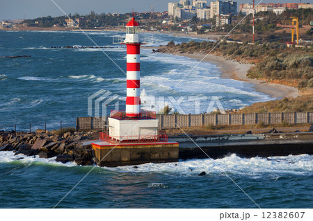 Lighthouse, stormy sea 12382607