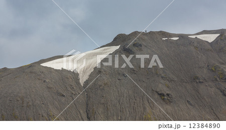 Tourists along the ridge in Landmannalaugar lava landscape Tourists along the ridge in Landmannalaugar lava landscape 12384890