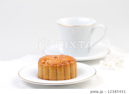 Moon cake served with tea Moon cake served with tea 12385431