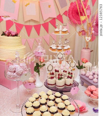 Sweet holiday buffet with cupcakes and meringues 12385763
