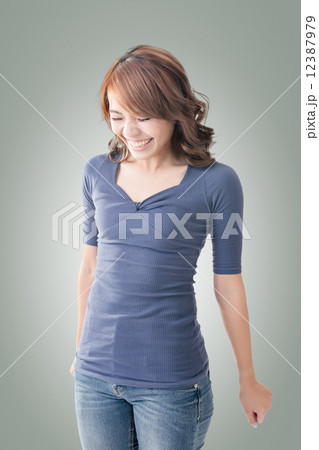 Shy Asian girl smiling 12387979