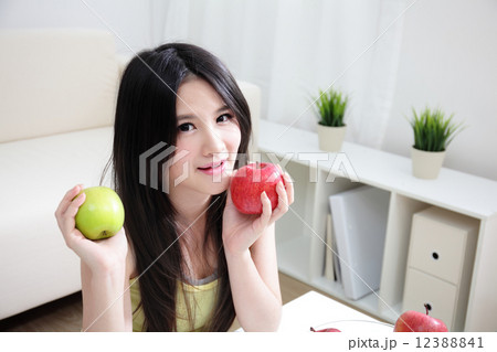 woman sitting enjoing fruits woman sitting enjoing fruits 12388841