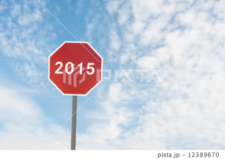 red road sign with a text of 2015 under blue sky 12389670