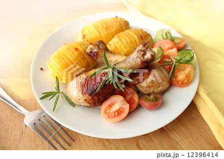 roasted chicken leg with fried potato  12396414