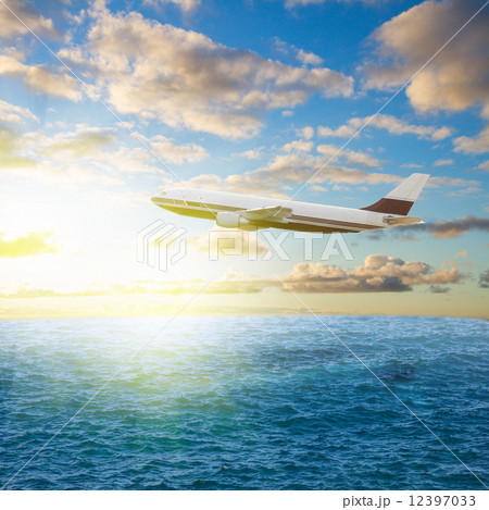 plane and sunrise 12397033