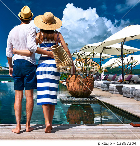 Couple near poolside Couple near poolside 12397204