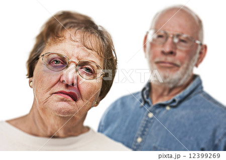 Battered and Scared Woman with Ominous Man Behind 12399269