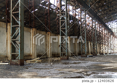 Blue steel pillar inside abandoned warehouse 12403626