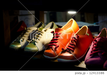 variety of the colorful leather shoes in the shop 12413386
