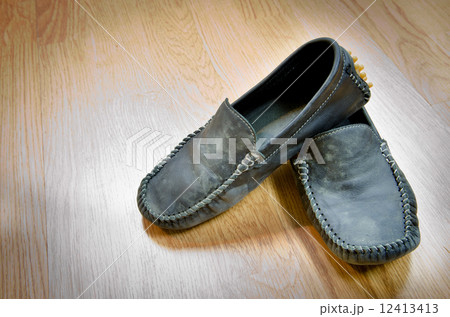 Dirty Shoes vintage style on wood floor Dirty Shoes vintage style on wood floor 12413413