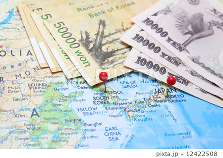 South Korean Won and Japanese Yen with pin on map 12422508