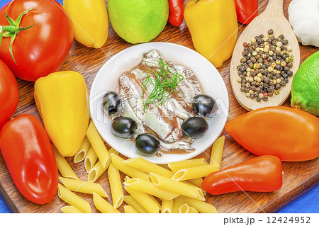 Anchovy fillets with olives and vegetables around Anchovy fillets with olives and vegetables around 12424952