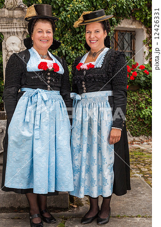 Two charming ladies in traditional dirndls 12426331