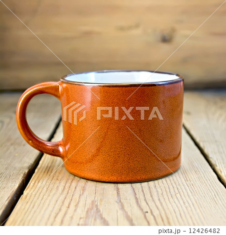 Mug brown on wooden board Mug brown on wooden board 12426482