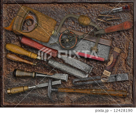 vintage woodworking tools over rusty plate 12428190
