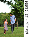 Asian Father and daughter enjoying a stroll at the park 12428656