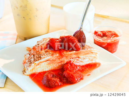 cheese crepe with sweet strawberry topping  ready to eat with co 12429045