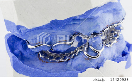 a partial denture on white background 12429983