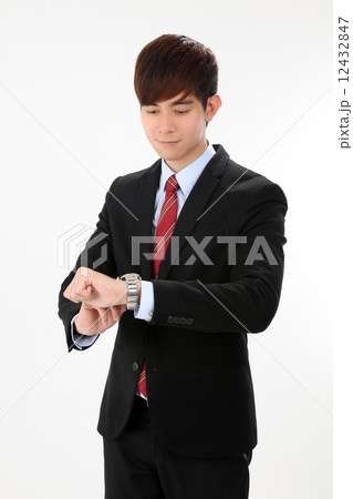 Asian female executive taking notes from boss or customer Asian female executive taking notes from boss or customer 12432847