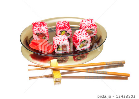 Japanese rolls on a plate on a white background with mirror refl Japanese rolls on a plate on a white background with mirror refl 12433503